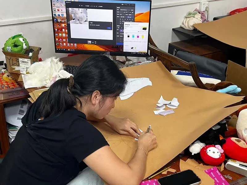 Pattern masters reviewing plush toy prototypes