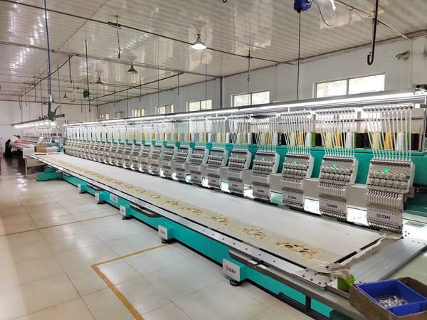 Quality inspection team reviewing finished plush toys