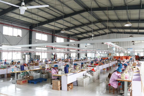 Mavo Toys production floor with sewing machines and workers